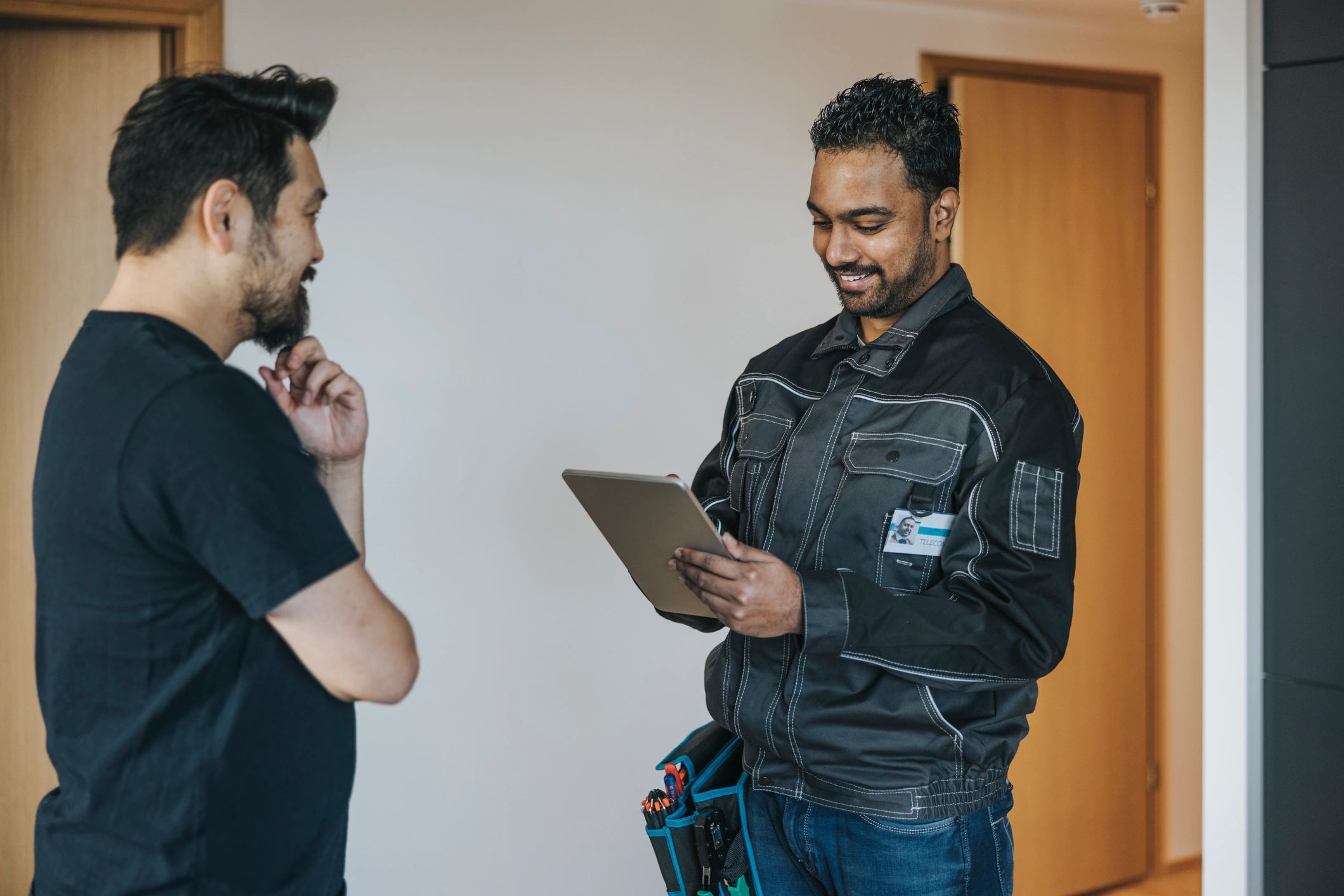 Maintenance professional speaking with a resident